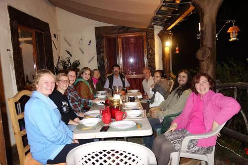 a group of people sitting at a table at Casa de campo vacacional "Tres Soles" en Xico, Veracruz in Xico