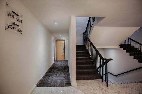 a staircase in a house with a stair case at The Marion Hotel in Johor Bahru