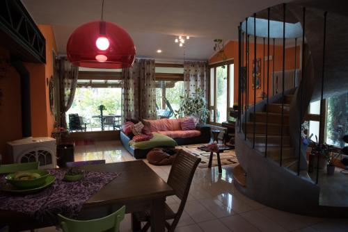 a living room with a couch and a table at La Luce della Luna in Castelnovo Bariano