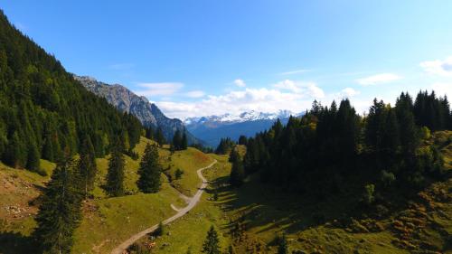 an aerial view of a winding road in the mountains at Walch's Camping & Landhaus in Braz