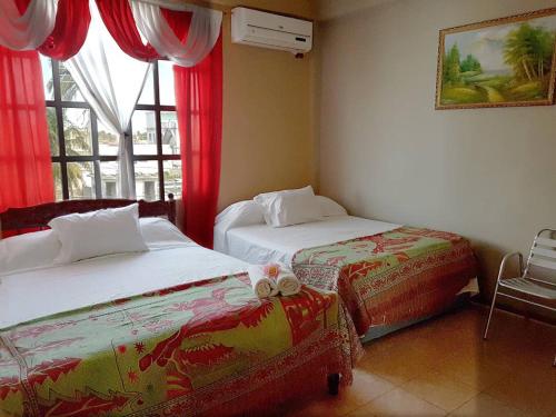 Una cama o camas en una habitación de Mirador Hotel
