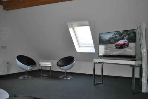 Televisyen dan/atau pusat hiburan di Ferienhaus Relax