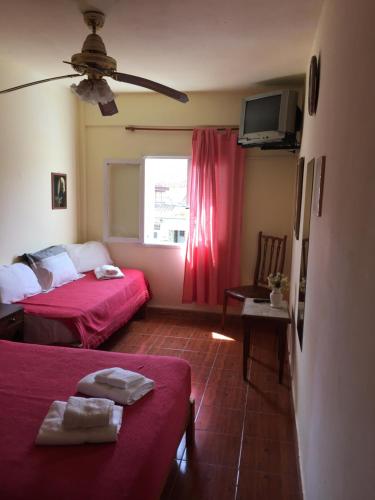 Postel nebo postele na pokoji v ubytování Hotel Loma Alegre