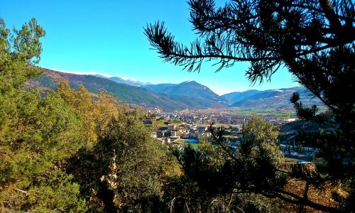 a view of a town with mountains in the background at Chalet "Rec dels Noguers" in Castellciutat
