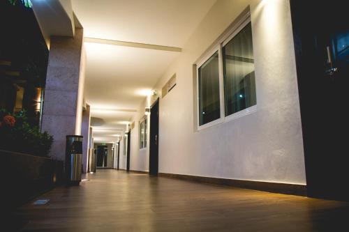 an empty hallway of a building at night at Luxury Hotel Inn in Peñita de Jaltemba