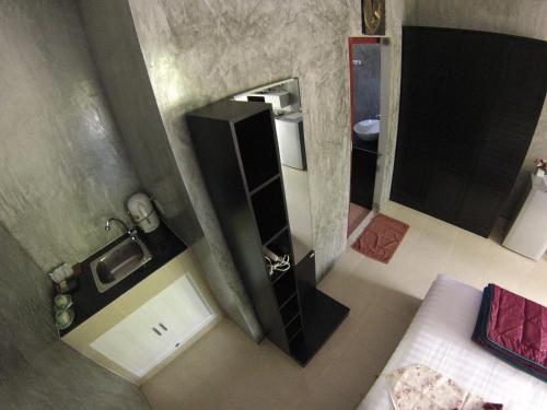 an overhead view of a bathroom with a sink and a mirror at Real Relax Resort in Ao Nang Beach