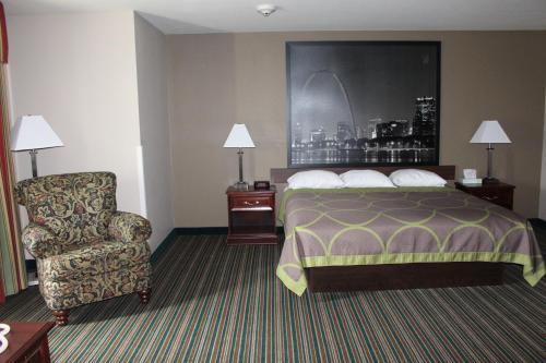 a hotel room with a bed and a chair at Super 8 by Wyndham Union in Union