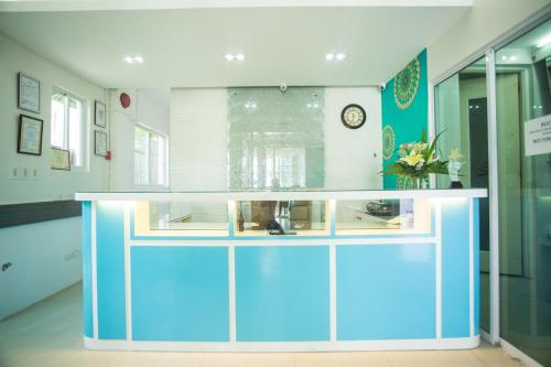 a lobby with a blue and white counter top at Grand Blue Beach Hotel in Boracay