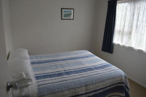 Ліжко або ліжка в номері Hahei Beach Escape