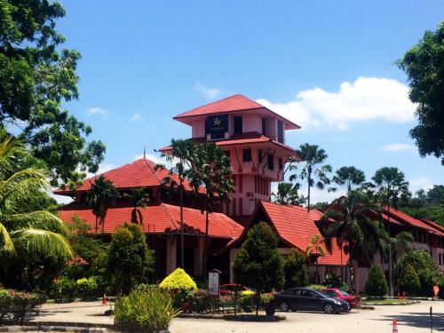 a building with a clock tower on top of it at Hotel Seri Malaysia Melaka in Melaka