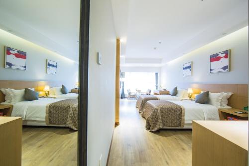 Katil atau katil-katil dalam bilik di Novo Hotel Chongqing