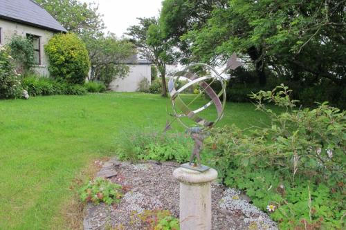 a metal sculpture in a garden in a yard at Muckle Flugga in Goleen