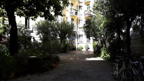 
a street filled with lots of trees and bushes at Bronzino House in Milan
