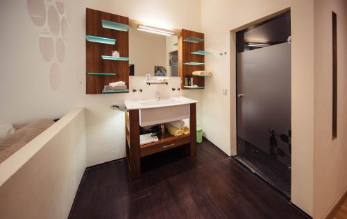 a bathroom with a sink and a mirror at Hotel Rathaus - Wein & Design in Vienna