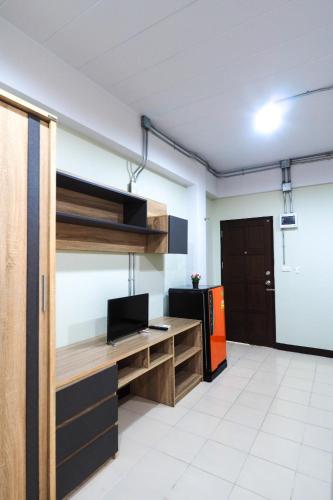 a room with a loft bed and a desk at Supreme Place SHA Plus in Khon Kaen