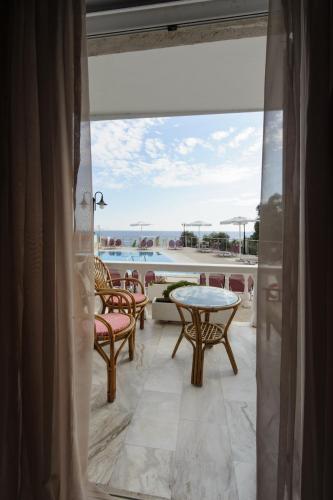 a view of a balcony with a table and chairs at Kanali Studios in Parga