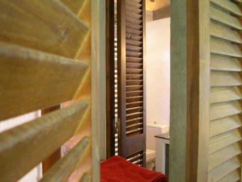 a room with a wooden wall and a stair case at Studios Kyparissi & Spa in Tiros