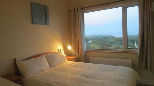 Un pat sau paturi într-o cameră la Ocean View