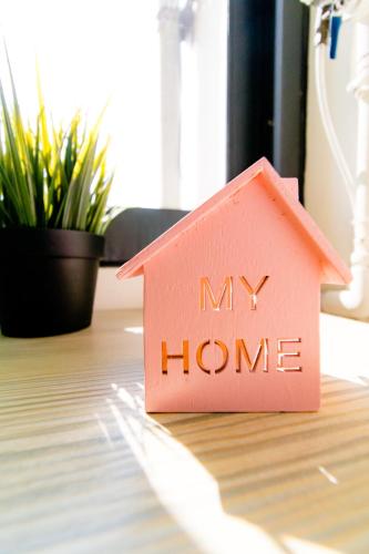 a pink house on a desk with the words my home at Lè mù in Taichung