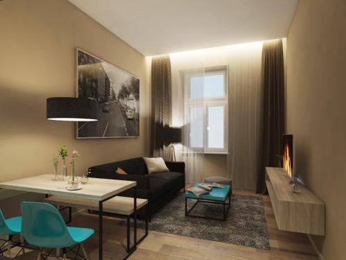 a living room with a couch and a table at Avenue Legerova 19 in Prague