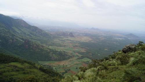 a view of a valley from the top of a mountain at Skyrock Inn in Kattappana