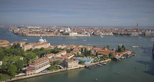 an aerial view of a city with a river at Hotel Cipriani, A Belmond Hotel, Venice in Venice