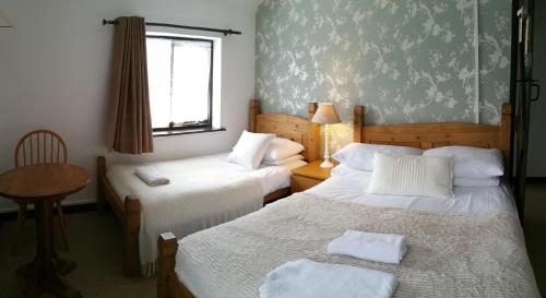 Cama o camas de una habitación en New Gurkha Inn