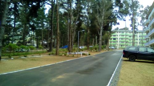 a car parked on the side of a street at Departamento Bosques del Tabo in El Tabo