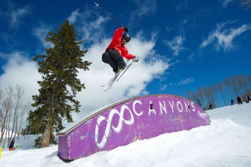 a person jumping a snow board in the air at Hyatt Centric Park City in Park City