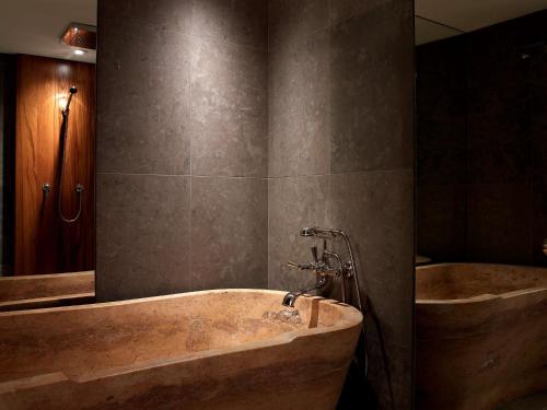 a large bathroom with a tub and a shower at Park Hyatt Washington in Washington