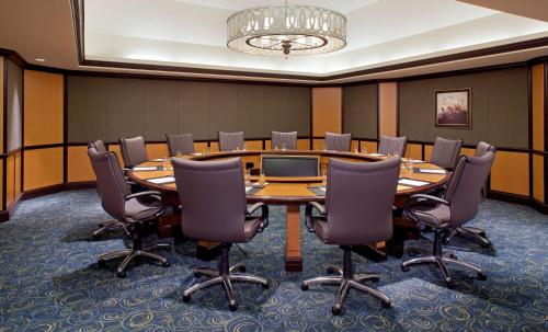 a conference room with a large table and chairs at Hyatt Regency Orlando International Airport Hotel in Orlando