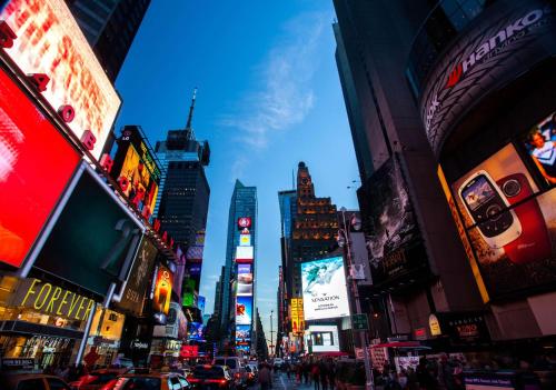 a view of a busy city street with buildings at Hyatt Centric Times Square New York in New York