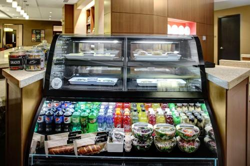 a display case in a store filled with drinks at Hyatt Place Columbia/Downtown/The Vista in Columbia
