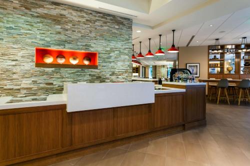 a lobby of a store with a white counter top at Hyatt Place Bloomington Indiana in Bloomington