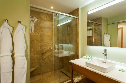 a bathroom with a shower and a sink at Grand Resort Jermuk in Jermuk