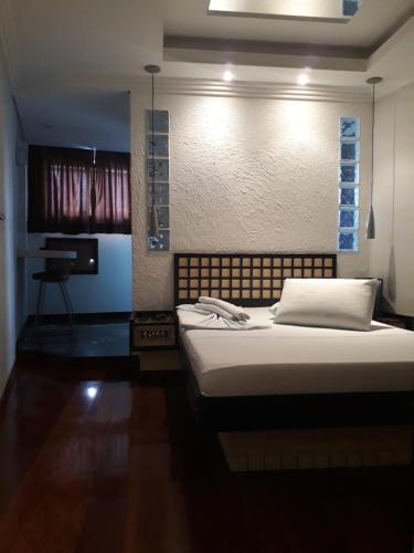 Ένα ή περισσότερα κρεβάτια σε δωμάτιο στο Platinum Hotel