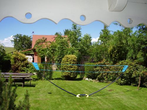 a frisbee is tied to a net in a yard at Ranczo w Dolinie Karpia - blisko "Energylandii" Zator in Spytkowice