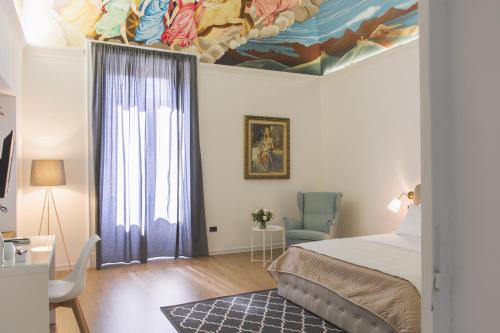 Ένα ή περισσότερα κρεβάτια σε δωμάτιο στο I Borbone