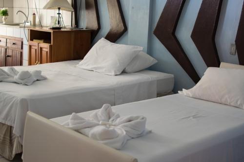 Postel nebo postele na pokoji v ubytování Hotel Valerie