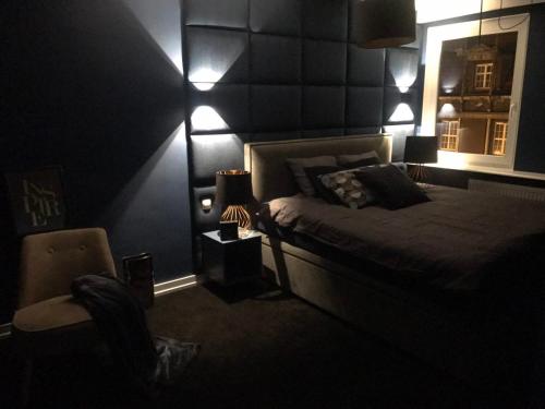 Ένα ή περισσότερα κρεβάτια σε δωμάτιο στο Apartament Mozart