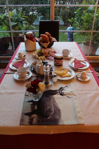 a table with a table cloth with food on it at Gasthof zum Hirsch in Neukirch