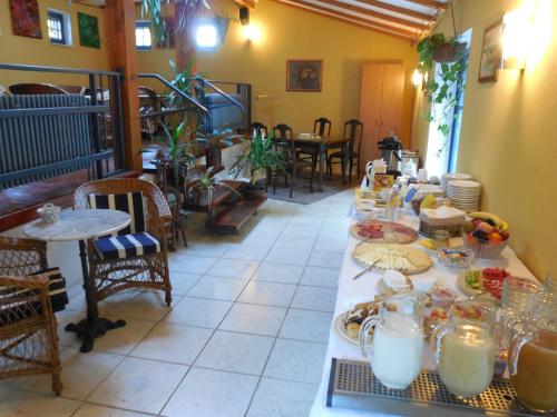 a long table with plates of food on it at Haus Nixe in Loddin