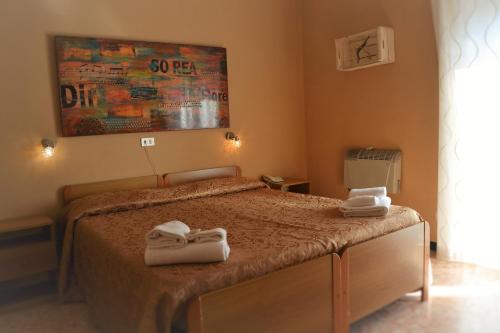 Ένα ή περισσότερα κρεβάτια σε δωμάτιο στο Hotel Eva La Romantica