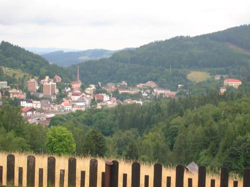 a view of a town from behind a fence at Pension Panorama in Tanvald