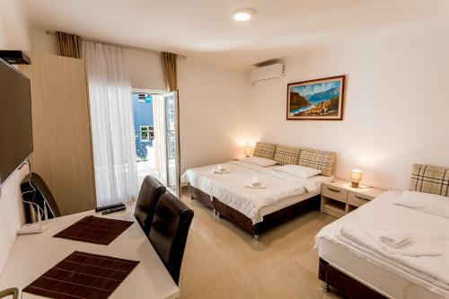Giường trong phòng chung tại Apartments Belani