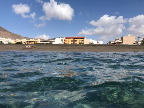 a view of a beach from the water at Apartamentos Ocean View in Gran Tarajal