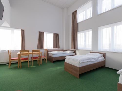 Postel nebo postele na pokoji v ubytování WinBudget "bed&breakfast"