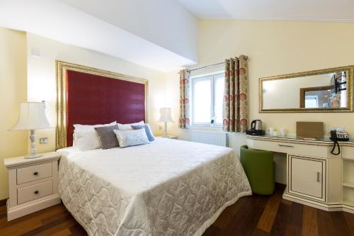 Postel nebo postele na pokoji v ubytování Linton Hotel Luton