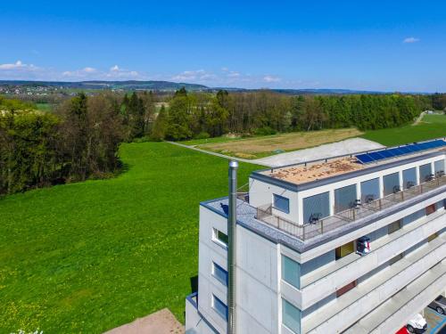 an overhead view of a building with a green field at Hotel Frauenfeld in Frauenfeld