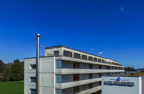 a building with a sign in front of it at Hotel Frauenfeld in Frauenfeld